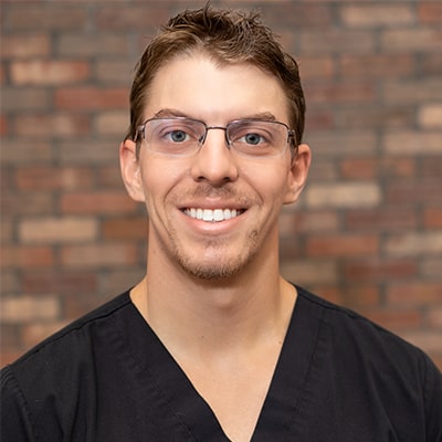 Portrait photo of Dr. Jarrett Stone, a dentist in Burleson, TX